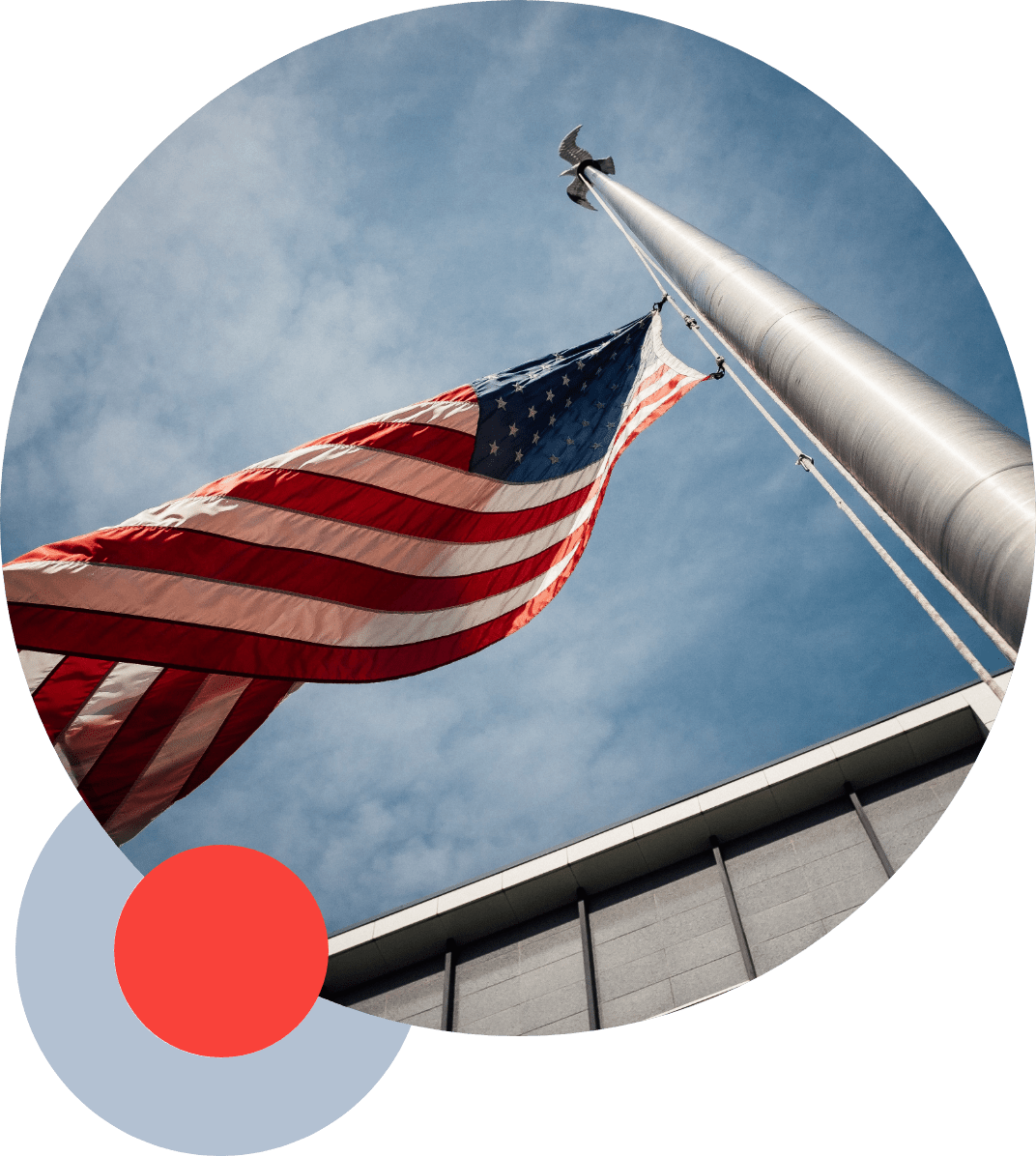american flag against a blue sunny sky